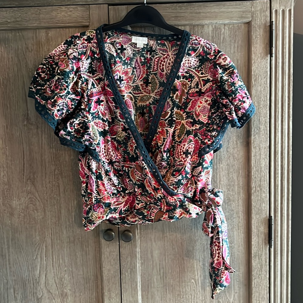 Floral blouse; flutter sleeves; faux wrap; tie waist